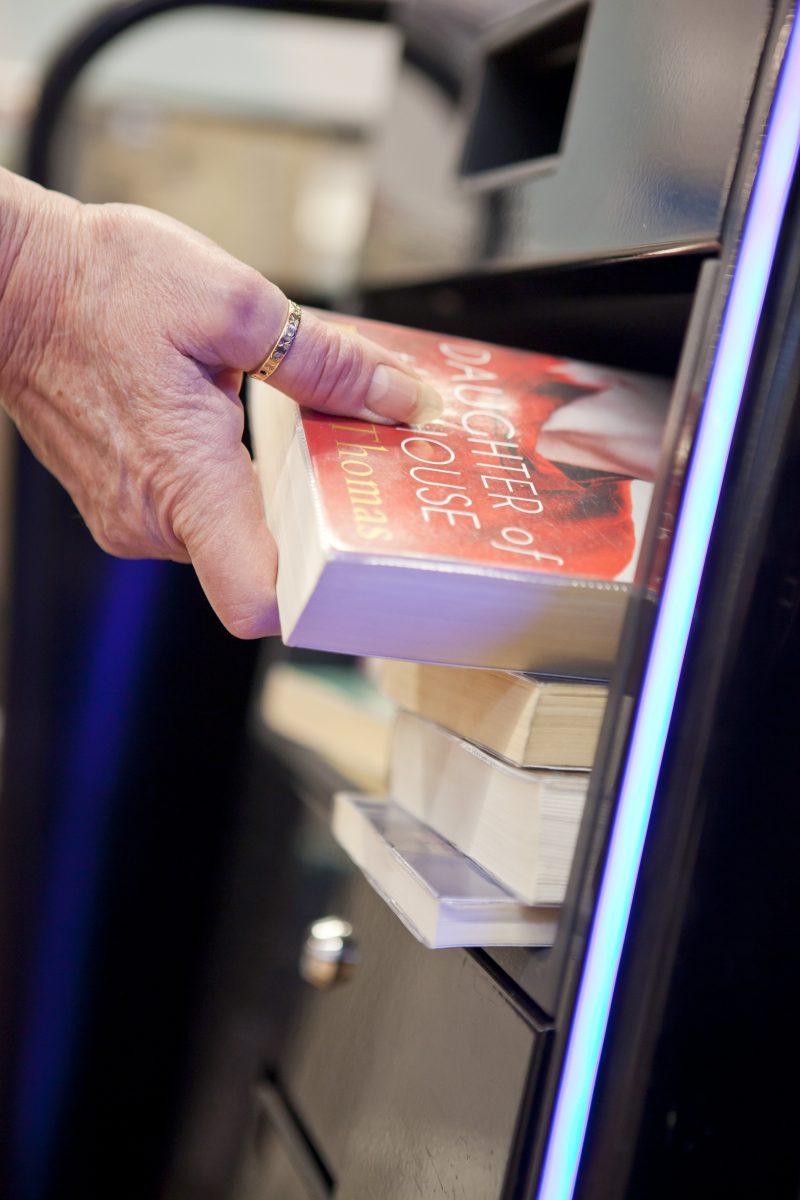 Books being placed into a self service machine